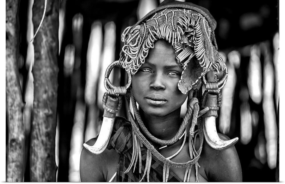 A portrait of a tribeswoman with a unique headdress.