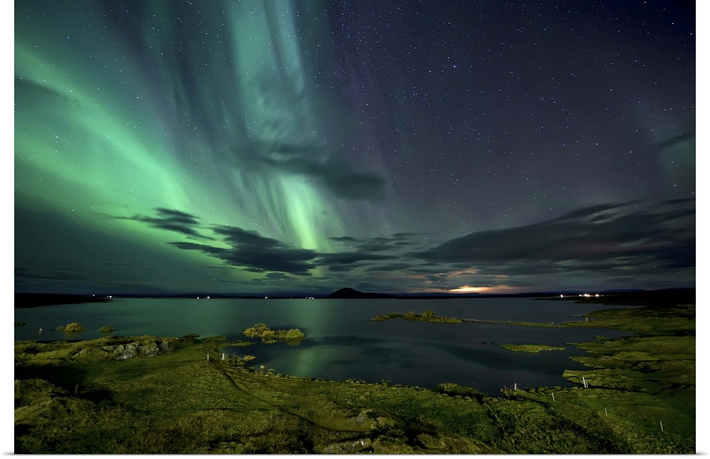 The northern lights seen above Myvatn Lake in Iceland at night.
