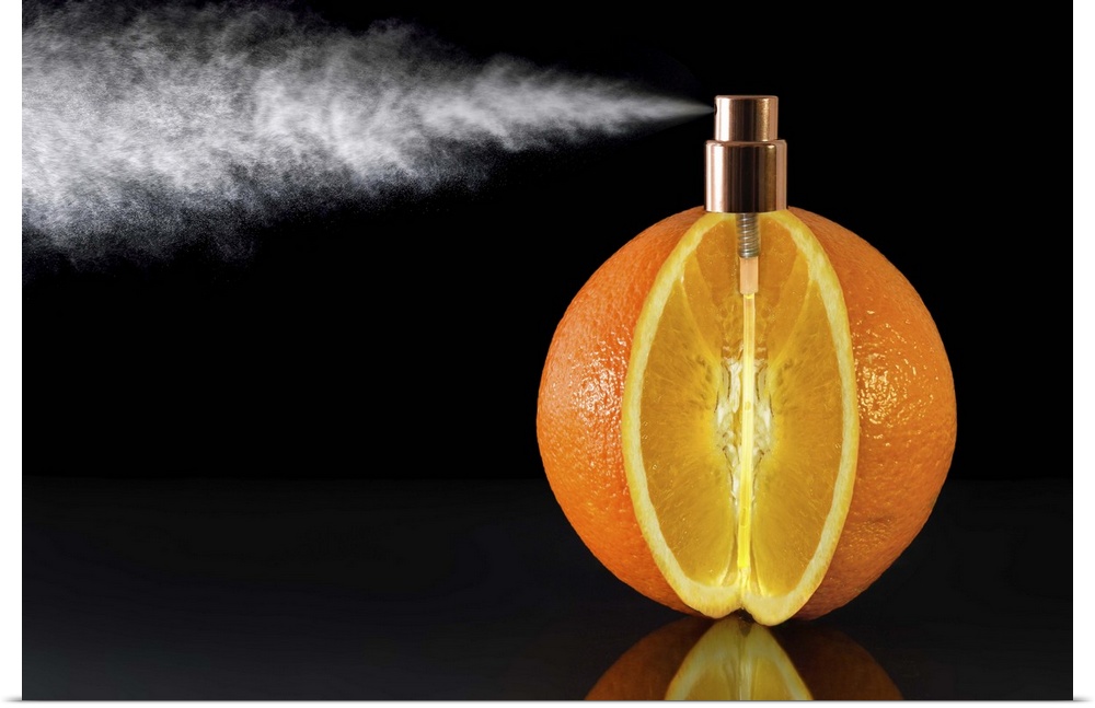 Conceptual photograph of an orange with a wedge cut of it and a spray nozzle fitted to the top of it.
