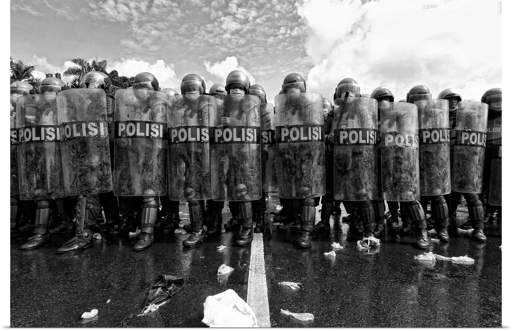 A black and white photograph of a police barricade.