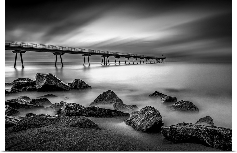 Long exposure black and white photograph of a seascape in Pint Del Petroli, Spain.
