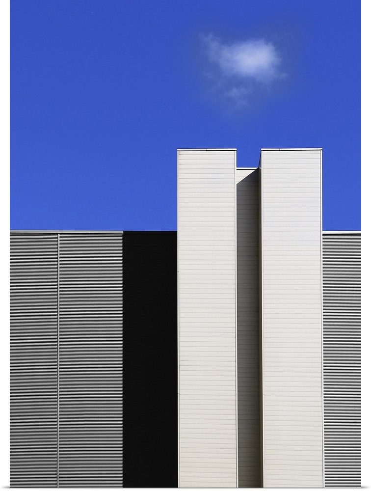 Architectural elements creating rectangular shapes, under a blue sky, Poland.