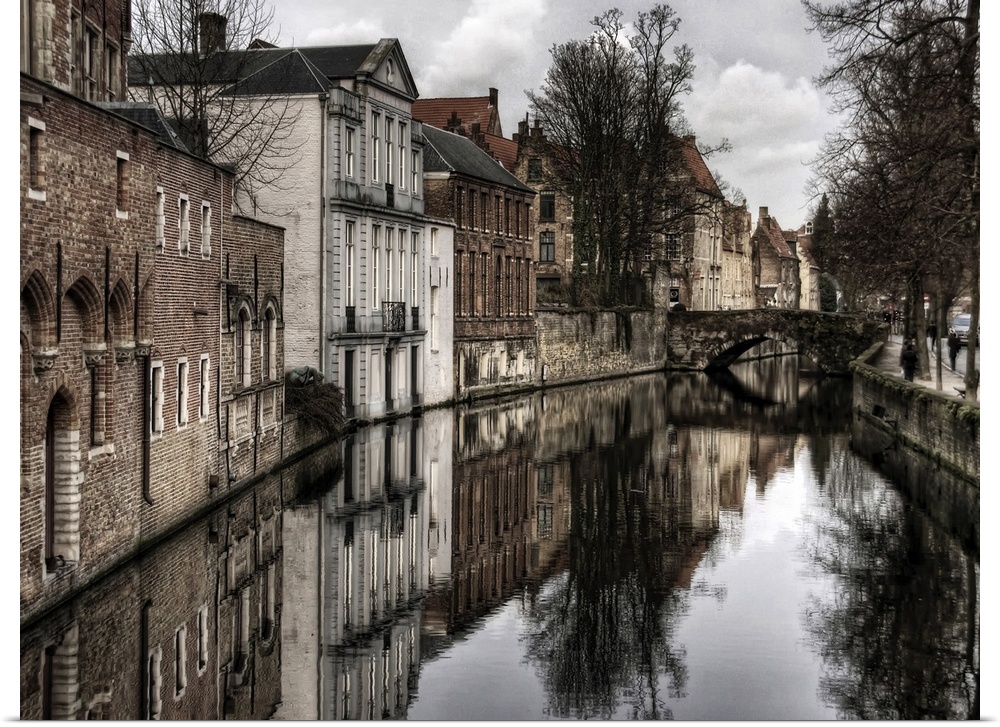 Canal in the city of Bruges, Belgium, on a cloudy day in the winter.