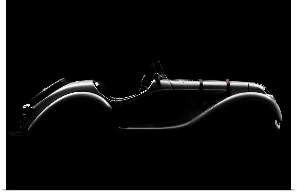 A BMW 328 Roadster in high contrast lighting creating a smooth outline.
