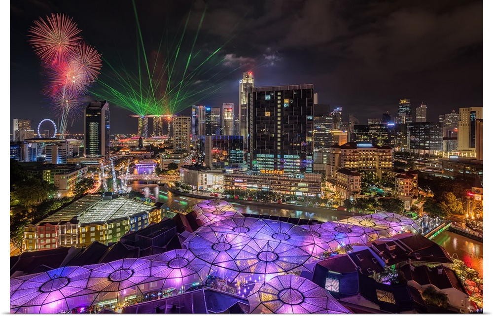 Laser lights and fireworks display in Singapore at night.