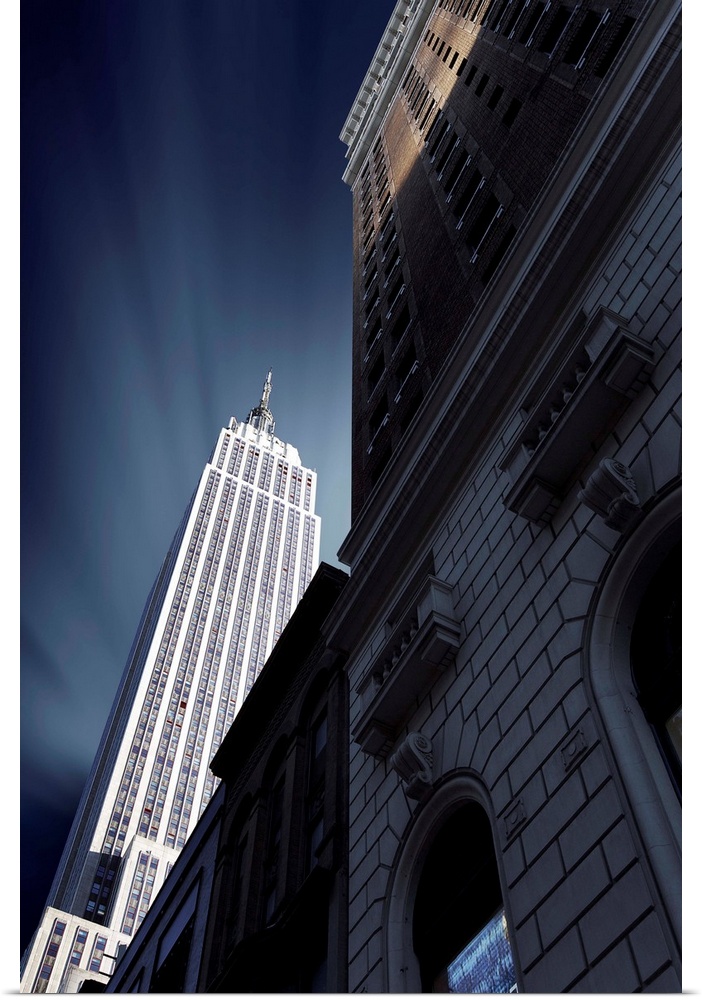 Looking up at the Empire State Building from the ground level, NYC.