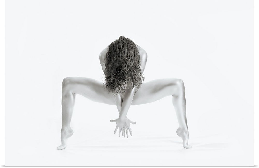 High key black and white portrait of a nude woman balancing and creating shapes with her body.