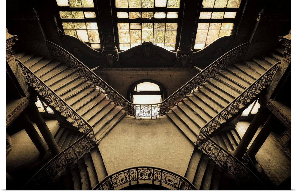 Photograph of crossing interior stairways in an abandoned palace in Cairo.