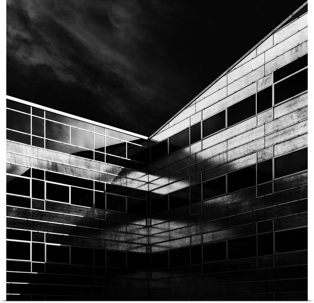 Square black and white architectural photograph of a building facade.