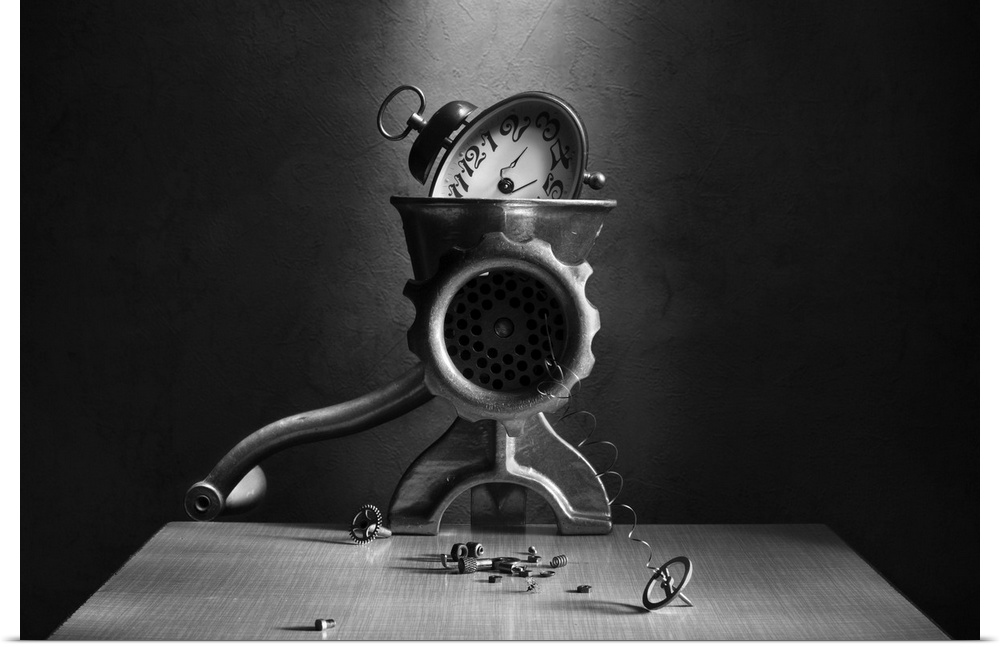 An alarm clock in a meat grinder, with springs and gears coming out.