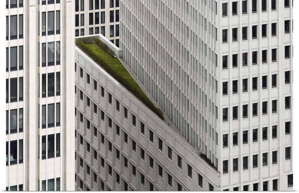 A balcony on the side of a skyscraper with greenery, Berlin, Germany.