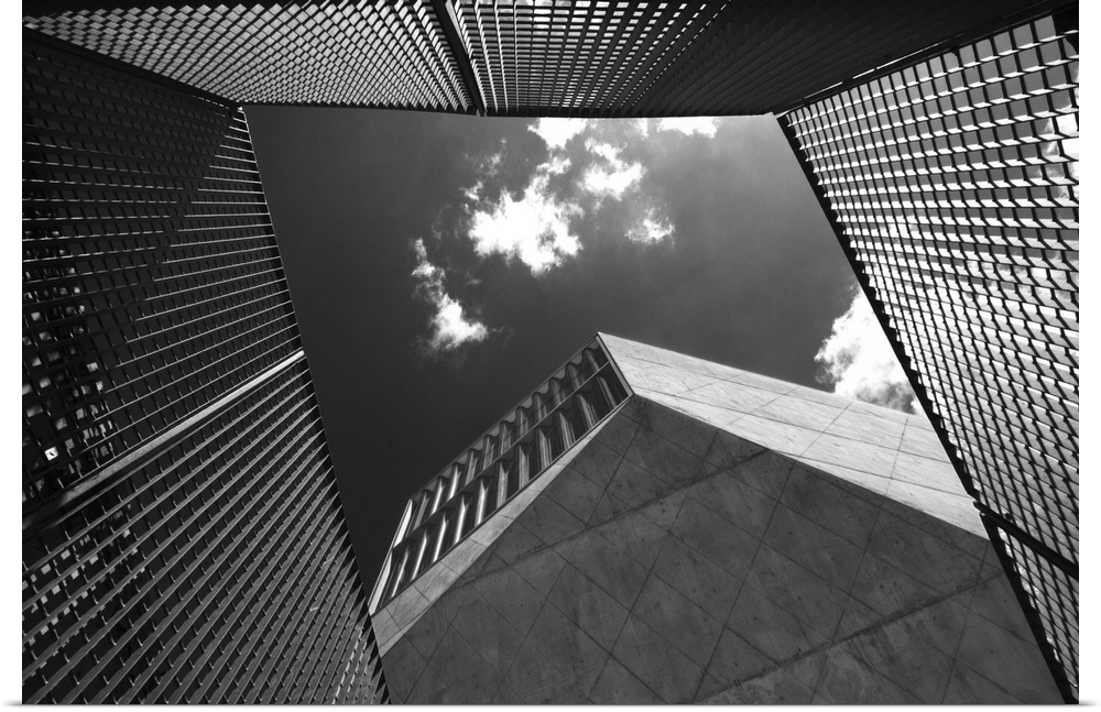 The edges of buildings creating a frame through which a sky can be seen.