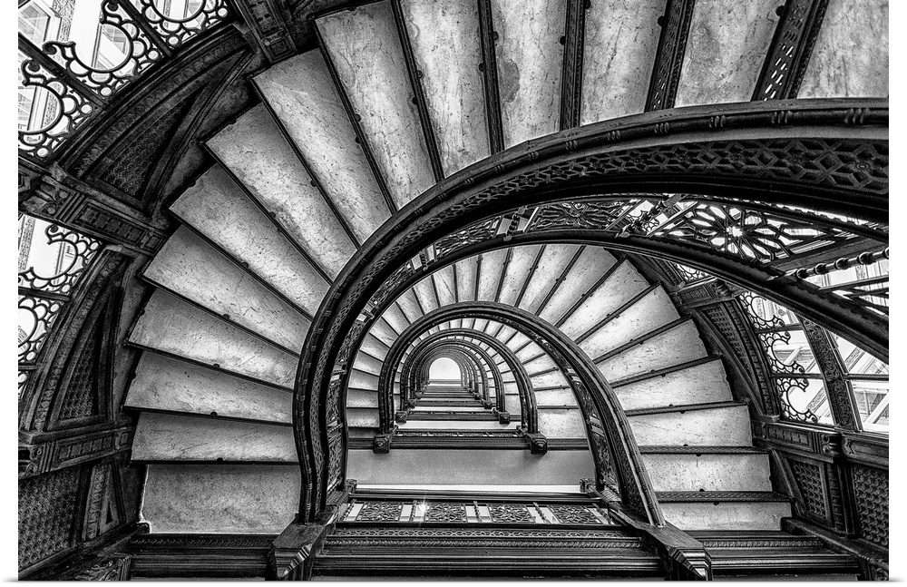 Black and white abstract photograph of a winding staircase.
