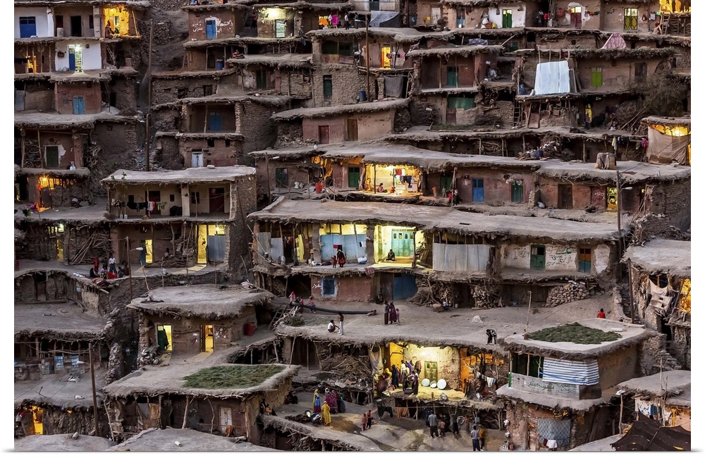 Homes in a village in Iran built into the side of a slope.