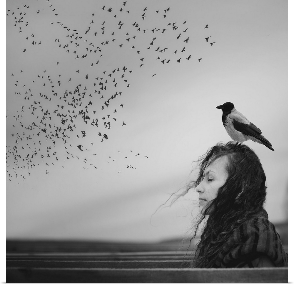 Black and white portrait of a woman with a magpie standing on her head, looking at a flock of birds in the sky.