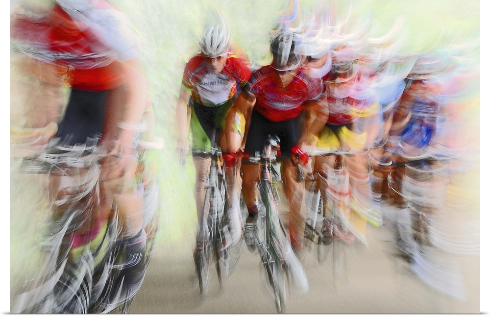 Action photograph of a cyclists in a blur of fast motion.