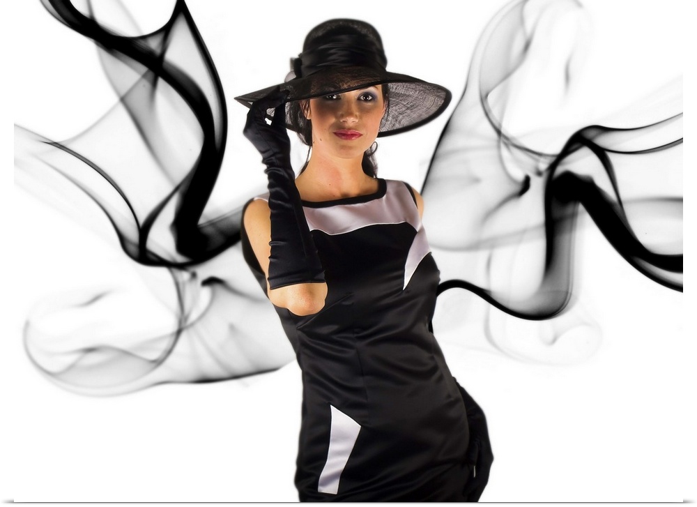 Portrait of a woman dressed in black with dark smoke around her.