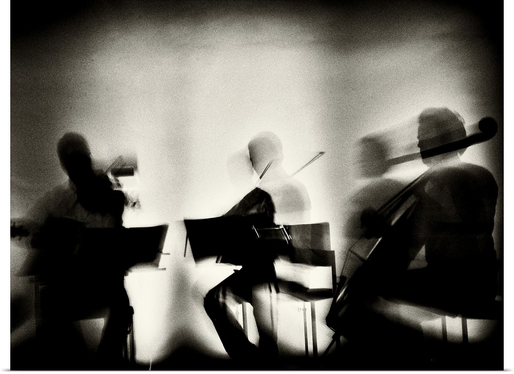 Motion blur image of a string quartet playing.