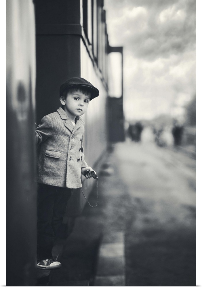 A small boy leans out the side of a train, Czech Republic.