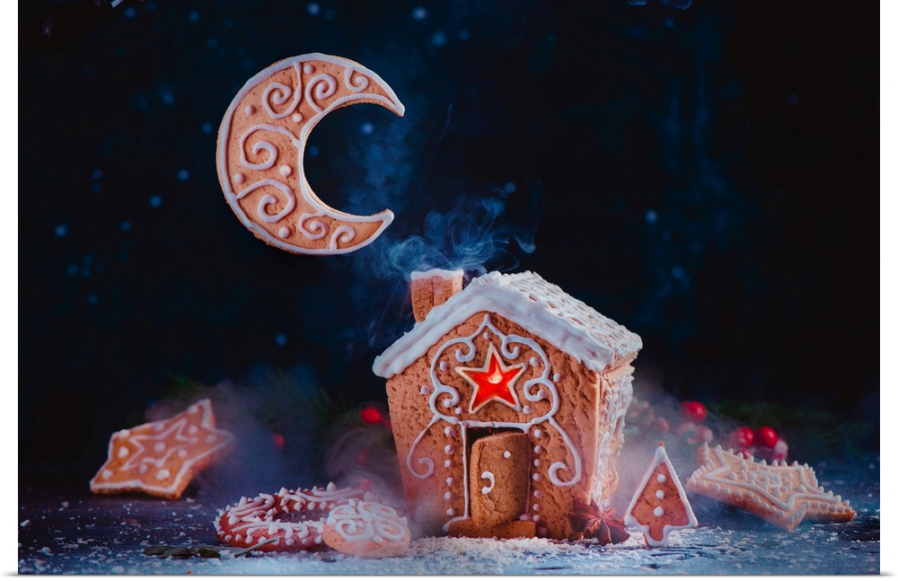 Christmas baking concept with a gingerbread house, shining caramel windows, biscuit Moon crescent and rising smoke from a ...