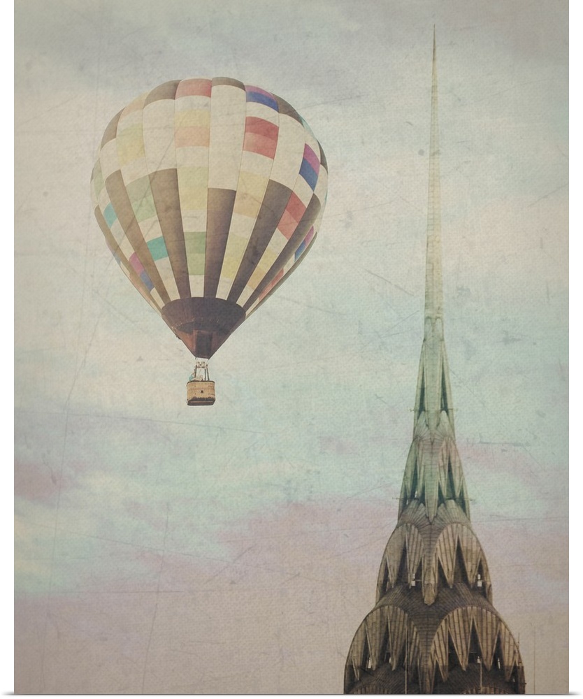 Artistically filtered photograph of the Chrysler building in NYC, with a hot air balloon in the sky.