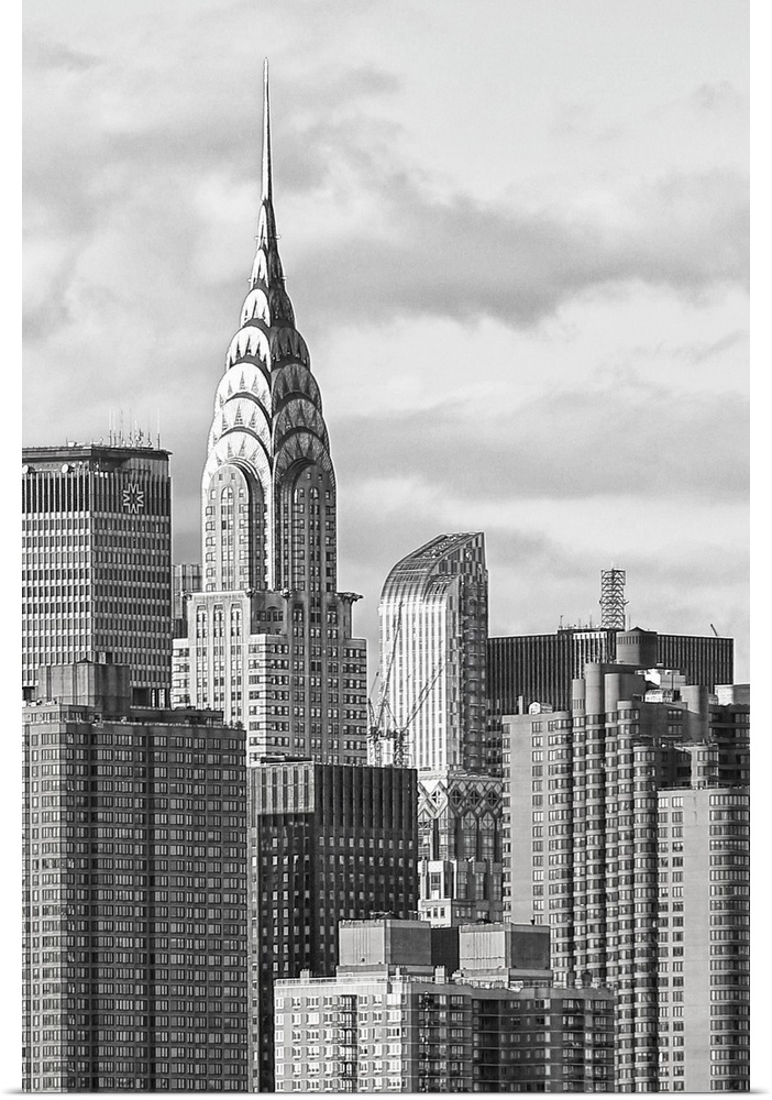 Black and white photograph of the New York City skyline. With the Chrysler building prominently standing tall.