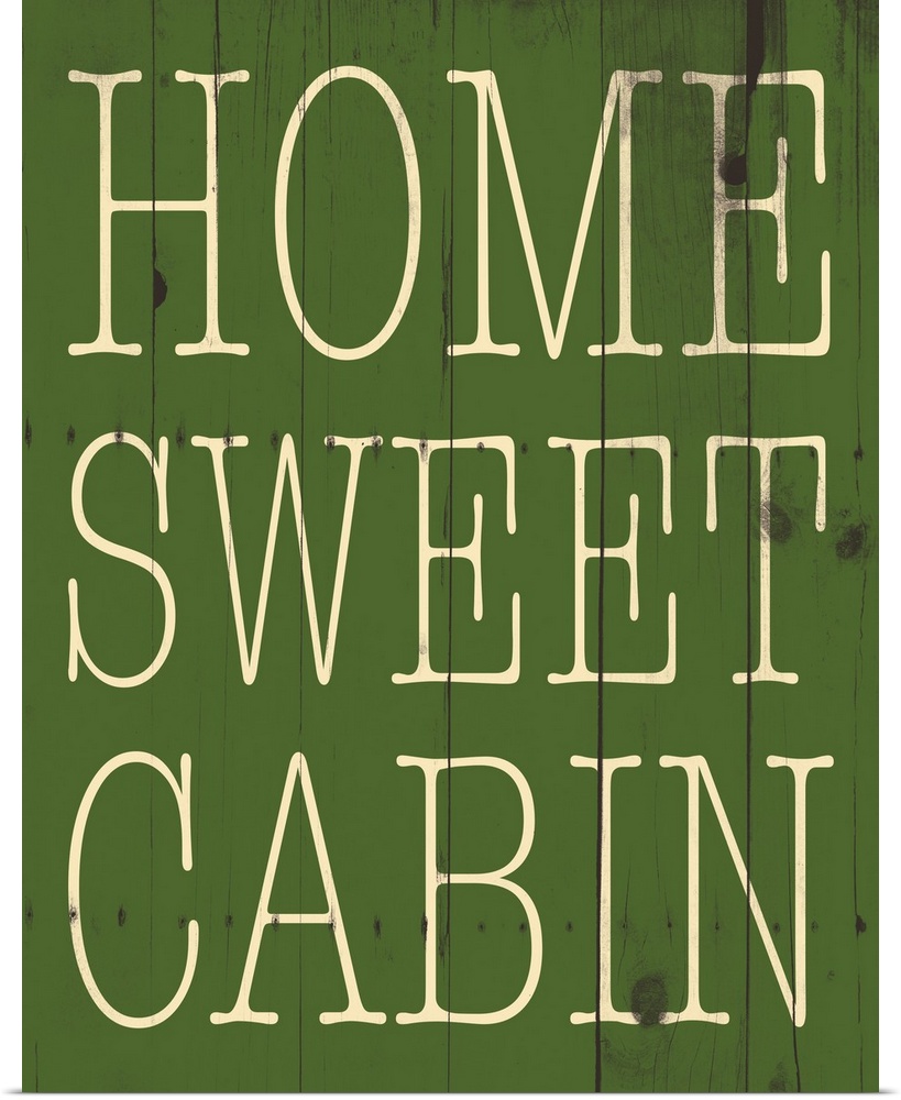 Typographical artwork with "Home sweet cabin" in a thin rustic text.