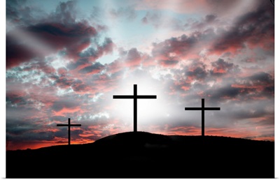 Three crosses on a hillside  Dramatic light announcing the resurrection
