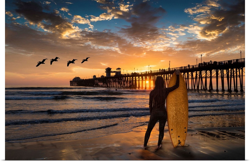 Woman surfer silhouetted at Oceanside Pier. The surf next to the Oceanside pier is a favorite surfing location. Oceanside ...