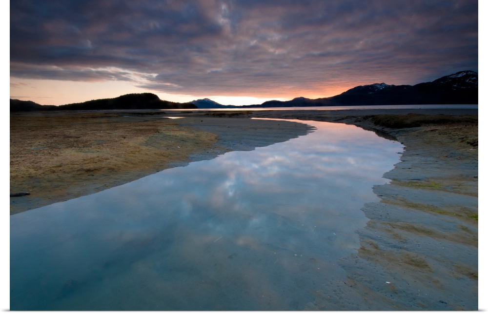 Evening sky reflects on the incoming tide at Harntey Bay near Cordova, Chugach National Forest, Southcentral Alaska, Spring
