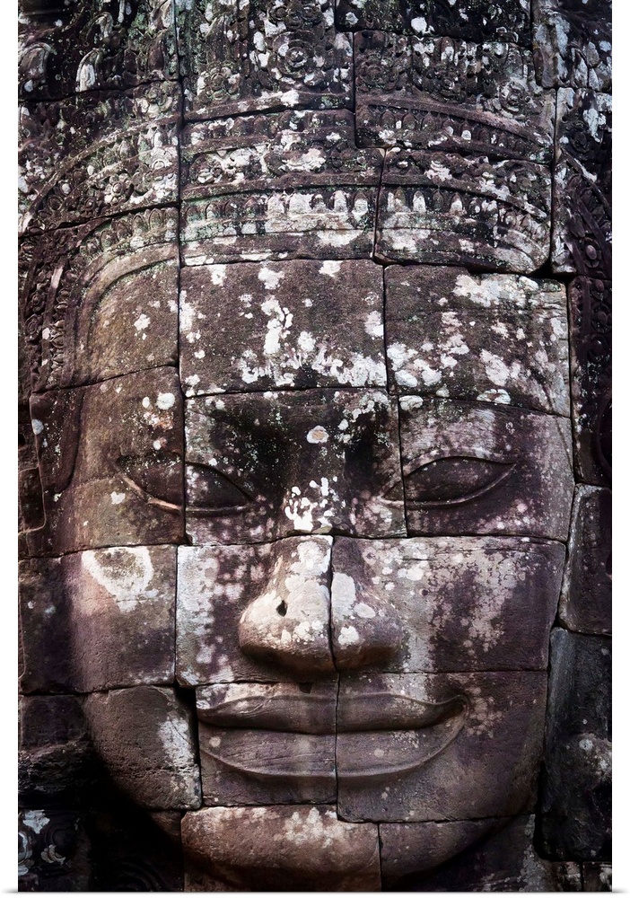 A face sculpture on a stone wall at angkor wat, Cambodia