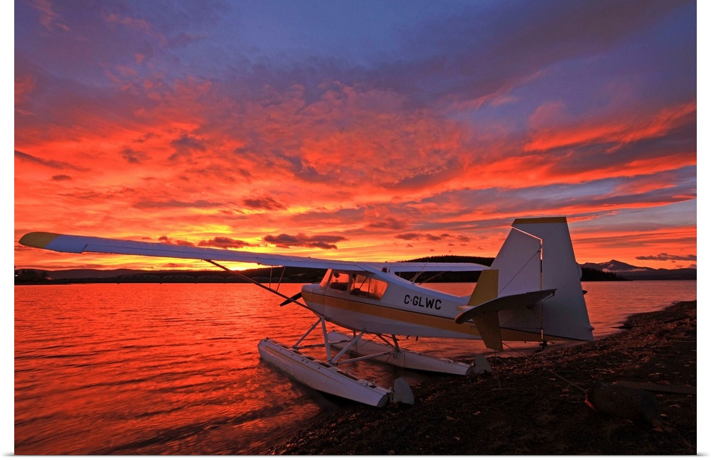 A Float Plane Facing The Sunrise Over Teslin Lake, Yukon, Canada