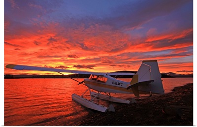 A Float Plane Facing The Sunrise Over Teslin Lake, Yukon, Canada