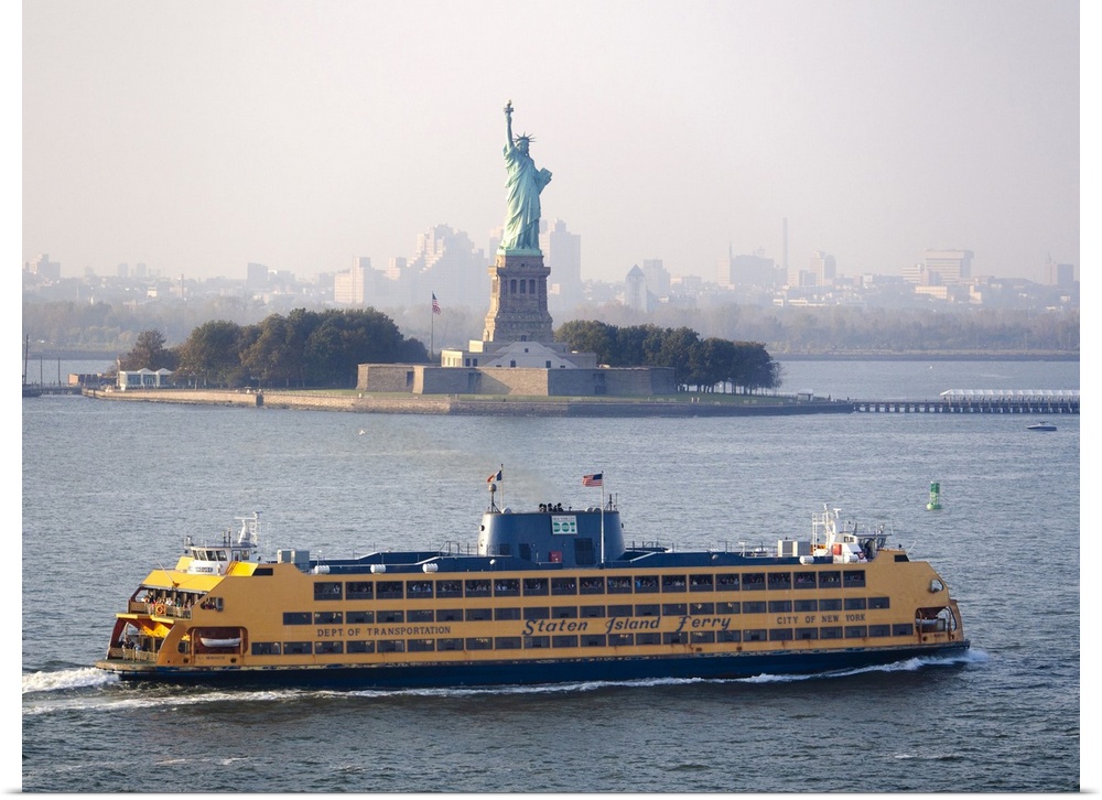 A Staten Island ferry passing the Statue of Liberty.