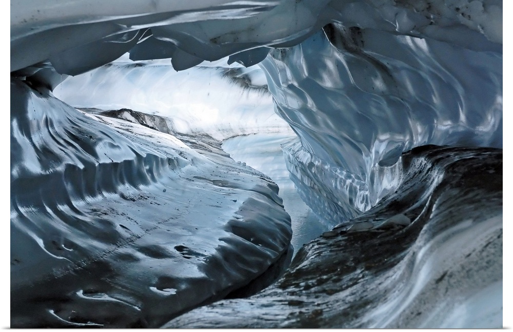 A photograph inside a tunnel that was formed by a water channel inside a glacier.