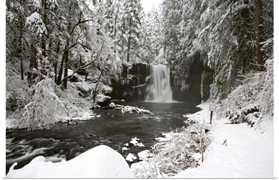 A Waterfall In To A River In Winter