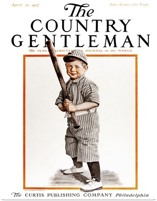 A young boy in a baseball uniform with a bat