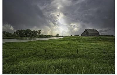 Abandoned Barn With Storm Clouds Converging Overhead, Nebraska, United States Of America