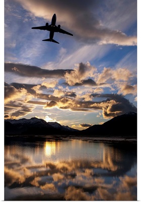 Alaska Airlines jet takes off from Juneau International airport at dawn, Juneau, Alaska