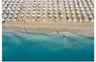 An Aerial View Of Kathisma Beach In Lefkada With People Enjoying The Deep Blue Waters