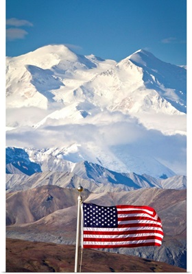 An American flag flys in the wind at Eielson Visitor Center