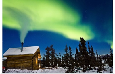 Aurora over cabin in the White Mountain recreation area during Winter in Interior Alaska