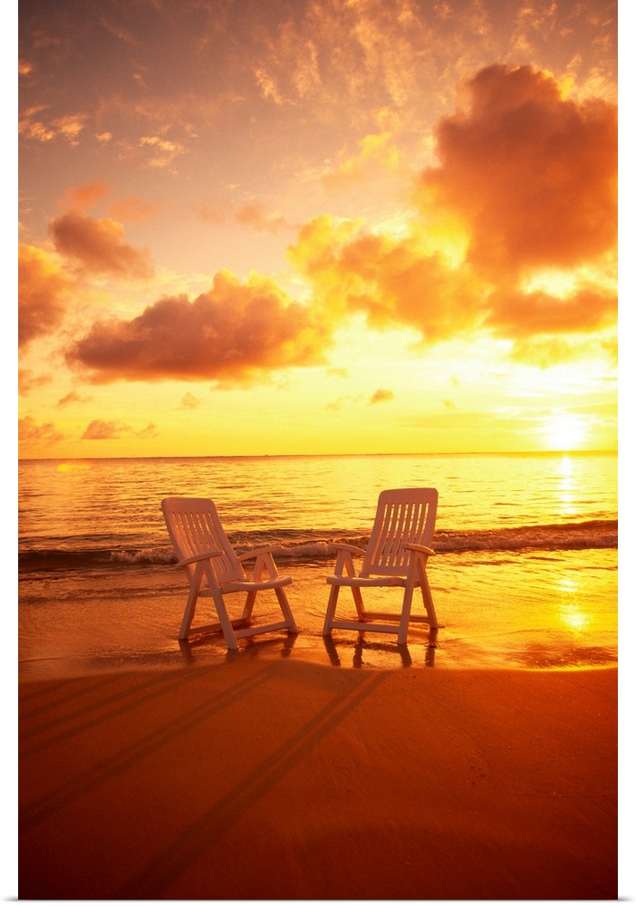 Beach Chairs Along Shoreline At Sunset