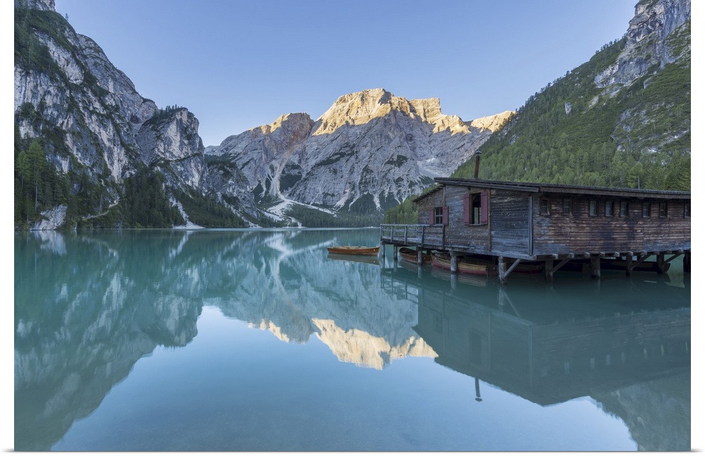 Boathouse with Croda del Becco (Seekofel) reflected in Braies Lake (Lago di Braies) in the Bolzano Province (South Tyrol) ...