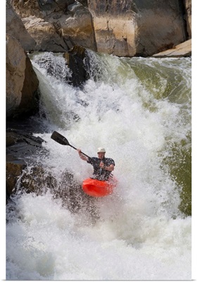 C-1 paddler goes down the Spout, the Virginia side of Great Falls on the Potomac River; Great Falls, Virginia, United States of America
