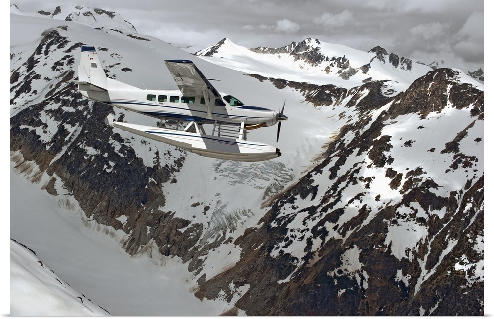 Cessna Caravan Amphibian Seaplane Flying Through Coast Mountains, British Columbia