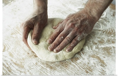 Close-Up Of Hands Kneading Dough