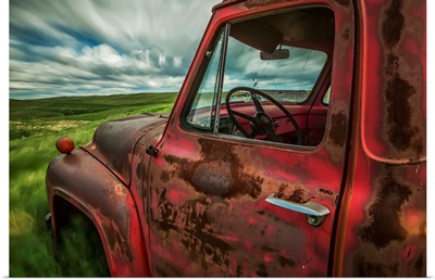 Clouds drifting by over an abandoned truck in a rural area, Saskatchewan, Canada