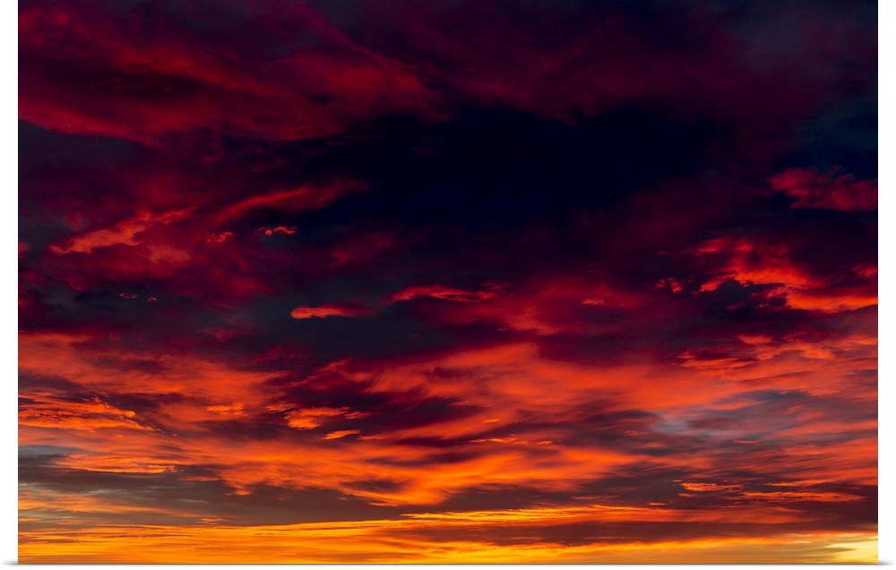 Dramatic colourful cloud formations at sunset; Calgary, Alberta, Canada