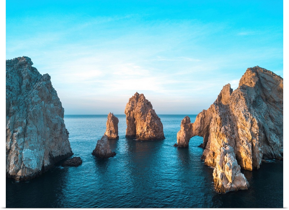 Dramatic rock formations and Arcos de Cabo San Lucas (Arch of Cabo San Lucas) on the coast at Lands End at sunset, Cabo Sa...